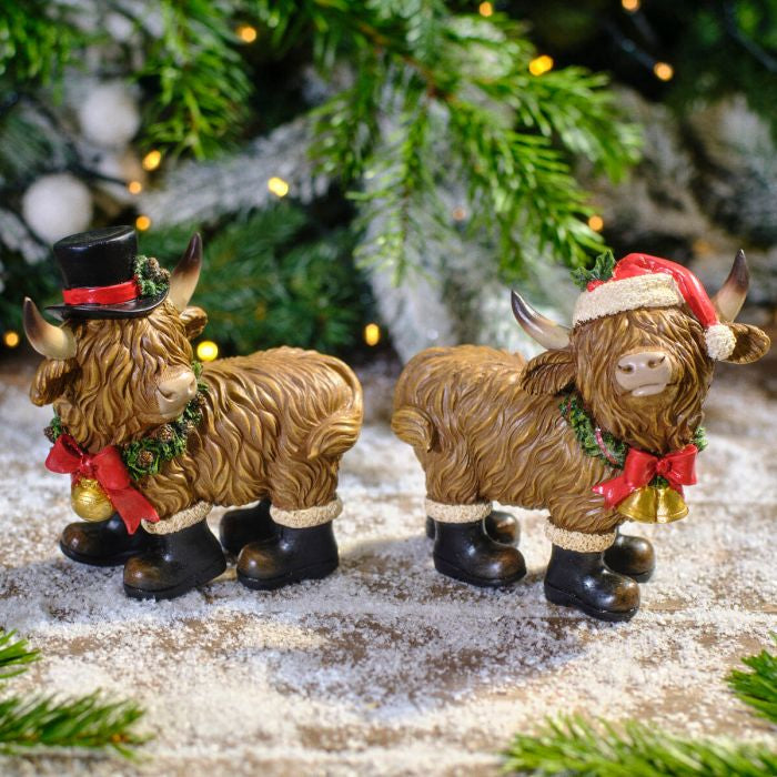 CHRISTMAS RESIN HIGHLAND COW WITH BOOTS HAT AND SCARF ORNAMENT